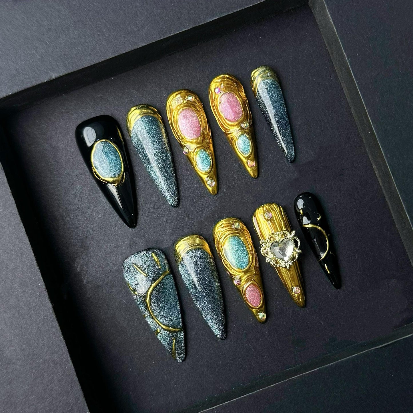 Celestial Metallic Galaxy Press-On Nails with Gold Sculpted Detail and Gem Accents. Artificial reusable fake glue on faux manicure nail art.