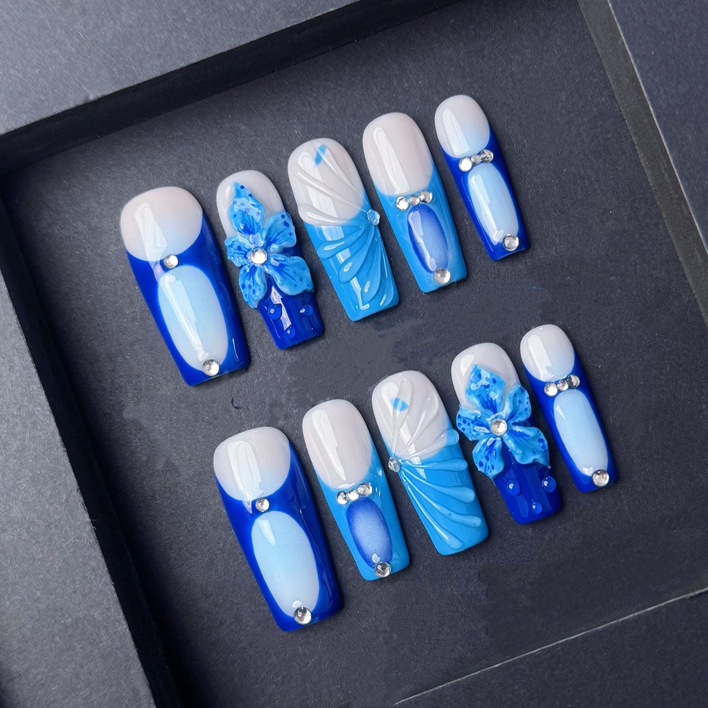 Blue Blossom Press-On Nails with Rhinestones and 3D Floral Accents. Artificial reusable fake glue on faux manicure nails trendy art.
