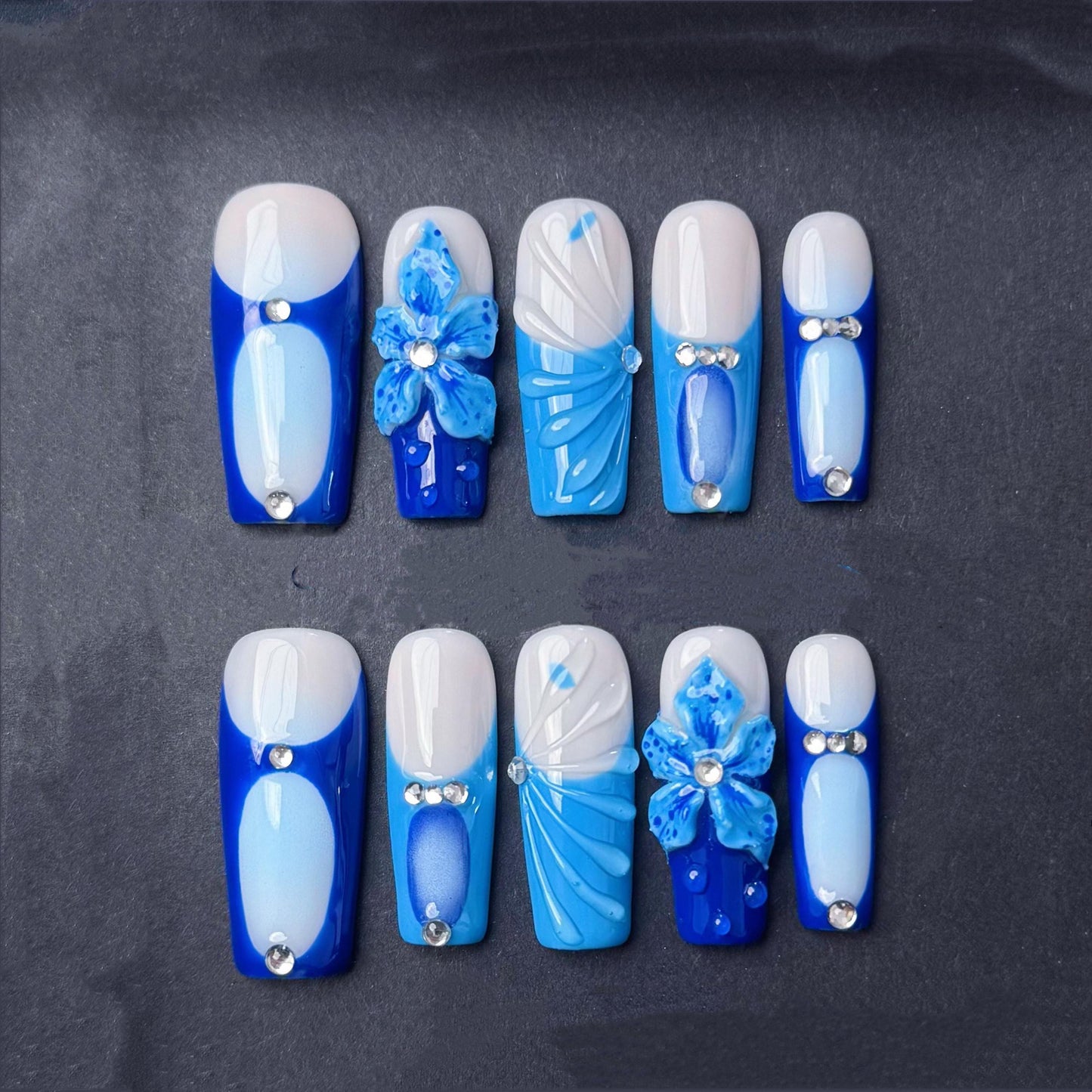 Blue Blossom Press-On Nails with Rhinestones and 3D Floral Accents. Artificial reusable fake glue on faux manicure nails trendy art.