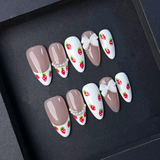 Cute Strawberry French Tip Nails with Pearls and Bows. Kawaii Press-On Set. Artificial reusable fake glue on faux manicure nails trendy art.