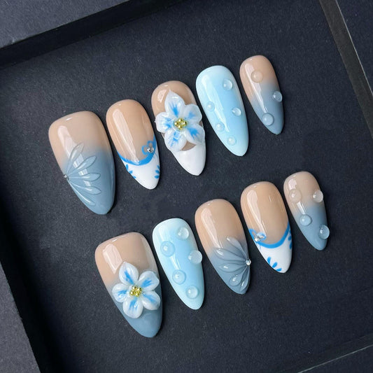 Soft Blue Gradient Floral Press-On Nails with 3D Embellishments. Artificial reusable fake glue on faux manicure nails trendy art.