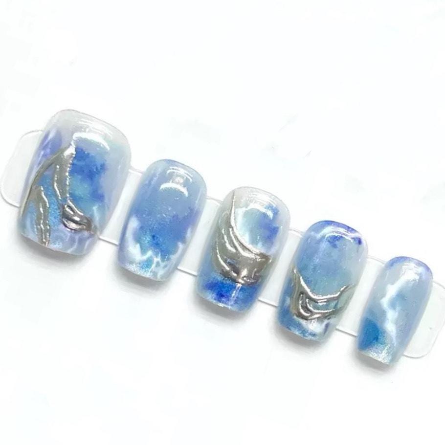 Ocean Swirl Blue Marble Press-On Nails with Silver Wave Accents. Artificial reusable fake glue on faux manicure nails trendy art.