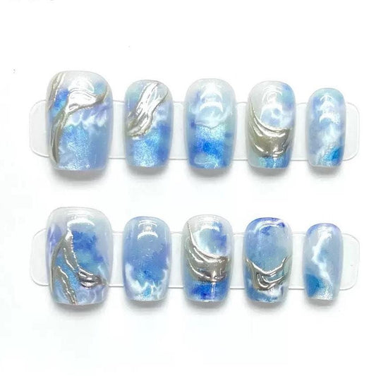 Ocean Swirl Blue Marble Press-On Nails with Silver Wave Accents. Artificial reusable fake glue on faux manicure nails trendy art.